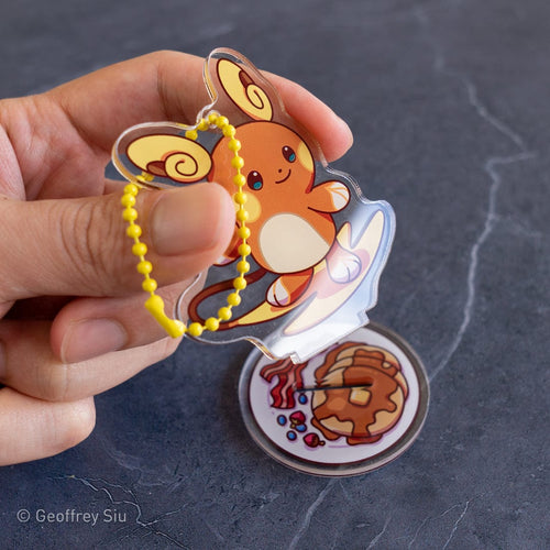 Geoffrey Siu Art Stationary Alolan Raichu Keychain & Stand Alolan Raichu Keychain & Stand | Geoffrey Siu at Valia Honolulu Valia Honolulu